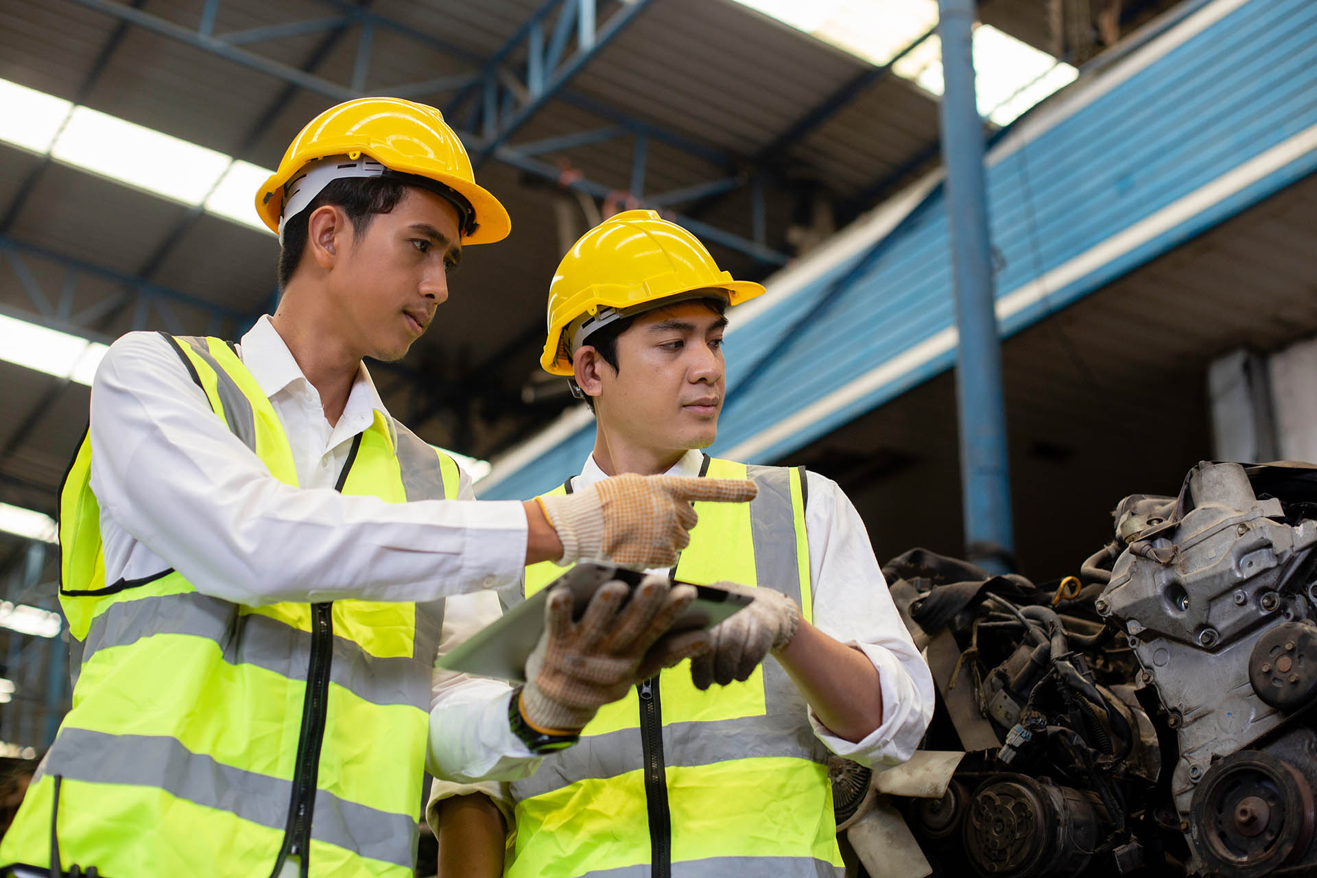Team engineers, Worker wear uniform and helmet talk and using ta
